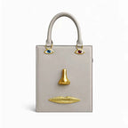 Sac bandoulière femme à visage décoratif et yeux bijoux