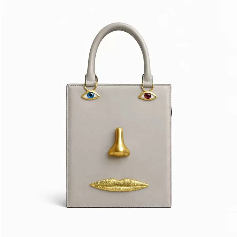 Sac bandoulière femme à visage décoratif et yeux bijoux