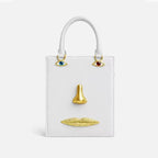 Sac bandoulière femme à visage décoratif et yeux bijoux