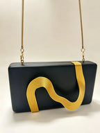 Pochette de soirée femme en simili cuir avec décor métallique