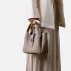 2026 Neue hochwertige Damen-Eimertasche aus Rindsleder, kleine Schulter-Umhängetasche, elegante Pendlerhandtasche für Damen, Grau